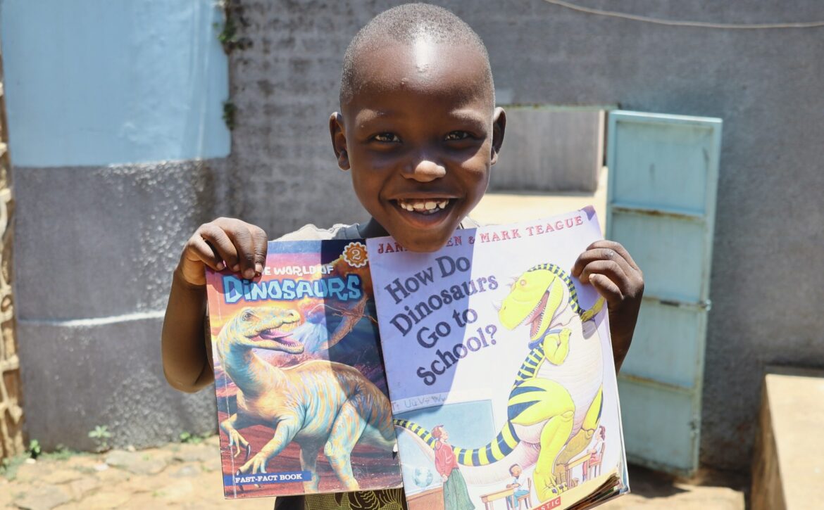 sbvtc-ecdc-student-poses-with-books