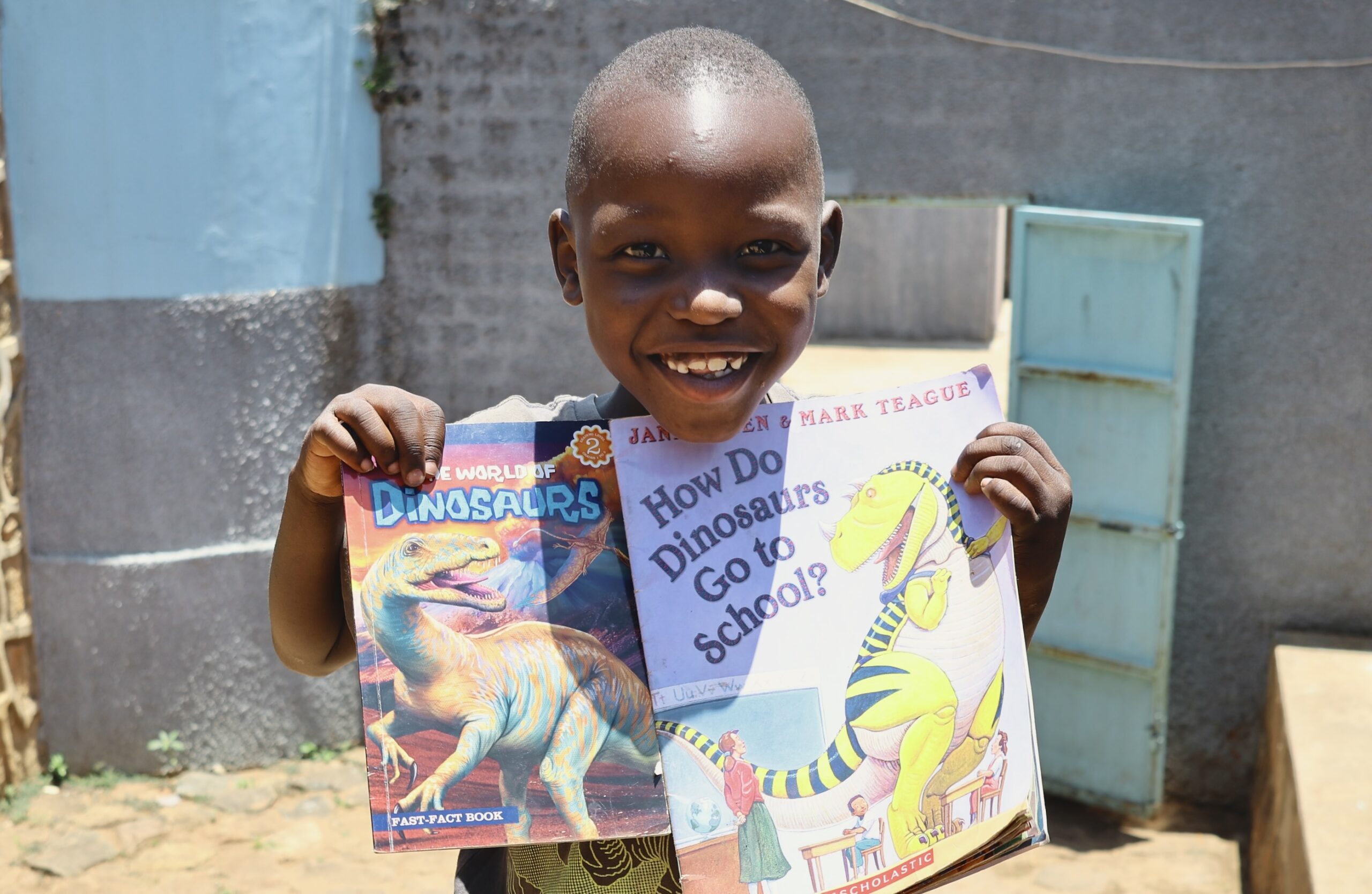 sbvtc-ecdc-student-poses-with-books